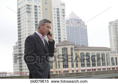 Caucasian businessman talking on cell phone View Large Photo Image Stock Photography - Caucasian businessman talking on cell phone. Fotosearch