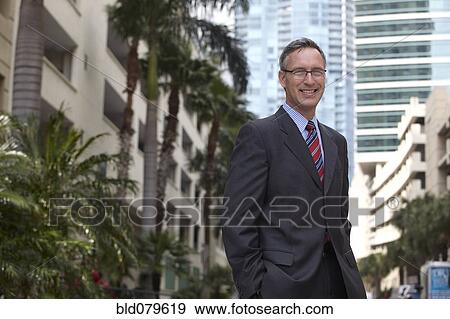 Caucasian businessman with hands in pockets View Large Photo Image Stock Photo - Caucasian businessman with hands in pockets. Fotosearch