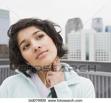 Hispanic woman checking pulse in city View Large Photo Image Stock Photo - Hispanic woman checking pulse in city. Fotosearch