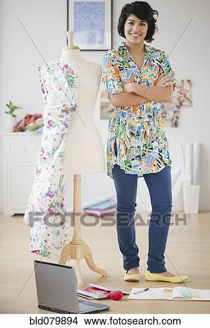 Hispanic woman standing with dressmaker's dummy View Large Photo Image Picture - Hispanic woman standing with dressmaker's dummy. Fotosearch