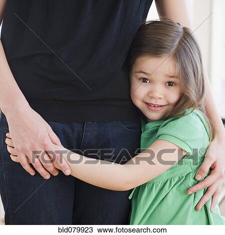 Mixed race girl hugging mother View Large Photo Image Stock Image - Mixed race girl hugging mother. Fotosearch