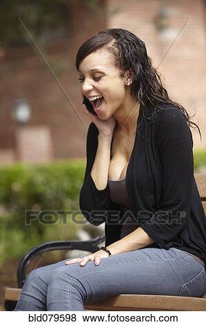 Mixed race woman talking on cell phone View Large Photo Image Stock Photo - Mixed race woman talking on cell phone. Fotosearch