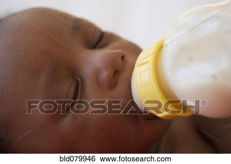 Newborn Black baby drinking from bottle View Large Photo Image Stock Photograph - Newborn Black baby drinking from bottle. Fotosearch