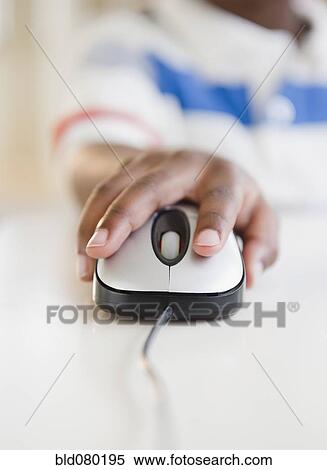 Black boy using computer mouse View Large Photo Image Stock Photography - Black boy using computer mouse. Fotosearch