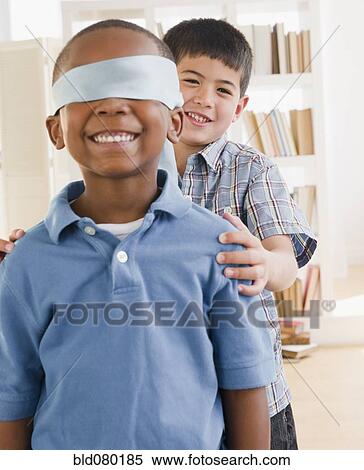 Boy spinning friend wearing blindfold View Large Photo Image Stock Photography - Boy spinning friend wearing blindfold. Fotosearch
