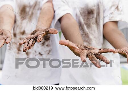 Stock Photo - Boys displaying their messy hands. Fotosearch