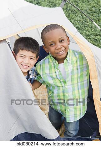 Picture - Boys playing in tent. Fotosearch