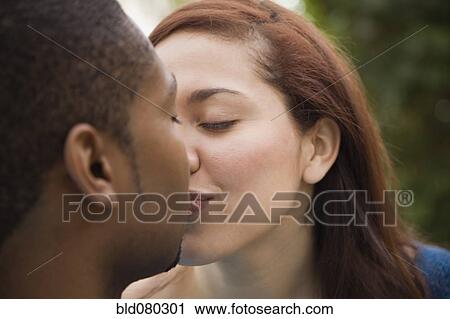 Stock Image - Couple kissing. Fotosearch