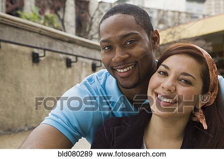 Stock Photo - Couple smiling together. Fotosearch