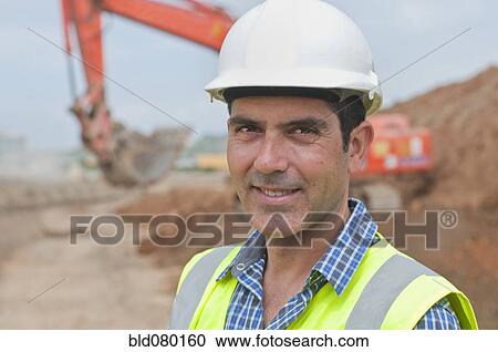 Stock Image - Hispanic construction worker on construction site. Fotosearch