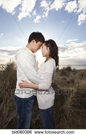 Korean couple hugging on beach View Large Photo Image Stock Photograph - Korean couple hugging on beach. Fotosearch