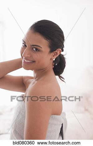 Middle Eastern woman wrapped in a towel View Large Photo Image Stock Image - Middle Eastern woman wrapped in a towel. Fotosearch