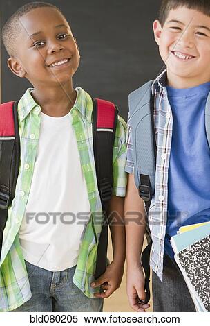 Smiling boys wearing backpacks View Large Photo Image Stock Photography - Smiling boys wearing backpacks. Fotosearch