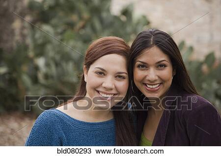 Stock Image - Woman smiling together. Fotosearch