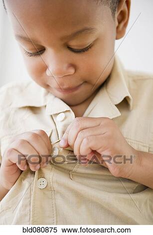 African American boy buttoning shirt View Large Photo Image Stock Photography - African American boy buttoning shirt. Fotosearch