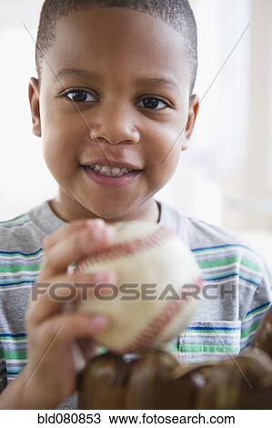African American boy holding baseball and baseball glove View Large Photo Image Stock Image - African American boy holding baseball and baseball glove. Fotosearch
