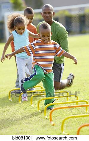 African American boy running across obstacle course View Large Photo Image Stock Image - African American boy running across obstacle course. Fotosearch