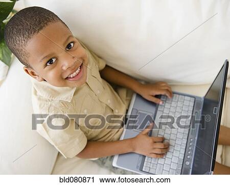 African American boy using laptop View Large Photo Image Stock Image - African American boy using laptop. Fotosearch