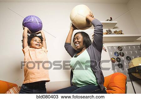 African American mother and son throwing balls View Large Photo Image Stock Image - African American mother and son throwing balls. Fotosearch