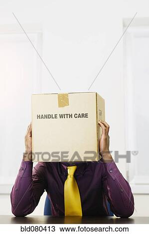 Black businessman with box over his head View Large Photo Image Stock Image - Black businessman with box over his head. Fotosearch