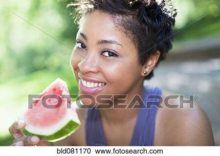 Black woman eating watermelon View Large Photo Image Stock Image - Black woman eating watermelon. Fotosearch
