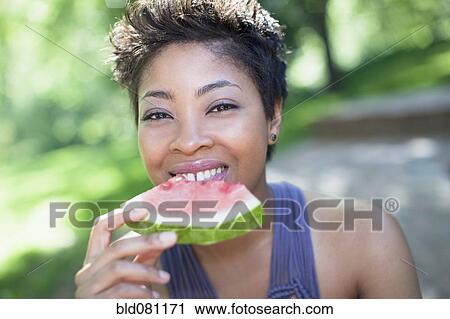 Black woman eating watermelon View Large Photo Image Stock Image - Black woman eating watermelon. Fotosearch
