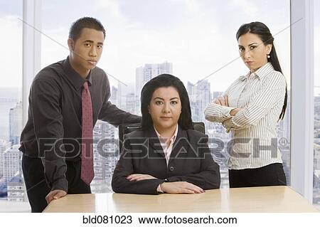 Business people posing in office View Large Photo Image Stock Image - Business people posing in office. Fotosearch