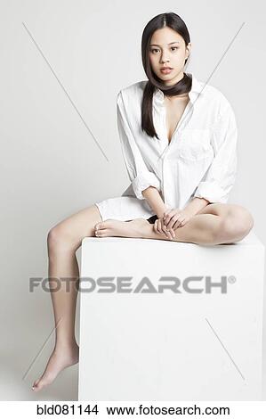 Chinese woman sitting barefoot View Large Photo Image Picture - Chinese woman sitting barefoot. Fotosearch