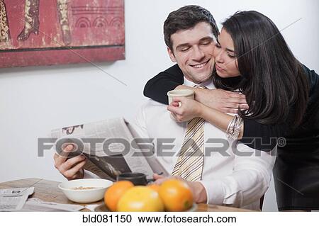 Couple eating breakfast and reading newspaper View Large Photo Image Stock Image - Couple eating breakfast and reading newspaper. Fotosearch