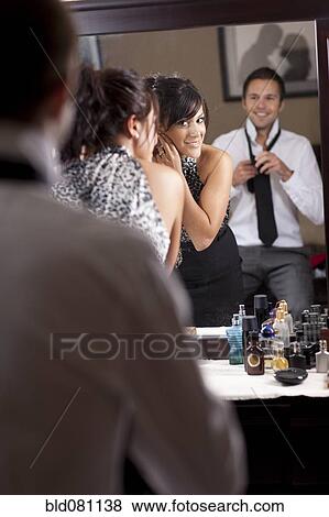 Stock Photo - Couple preparing for nightlife. Fotosearch