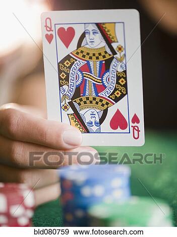 Hand holding queen of hearts playing card View Large Photo Image Stock Photo - Hand holding queen of hearts playing card. Fotosearch