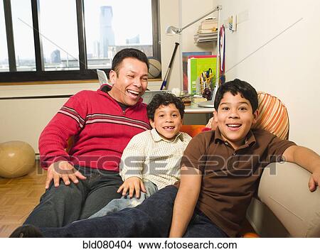 Hispanic father and sons laughing View Large Photo Image Picture - Hispanic father and sons laughing. Fotosearch