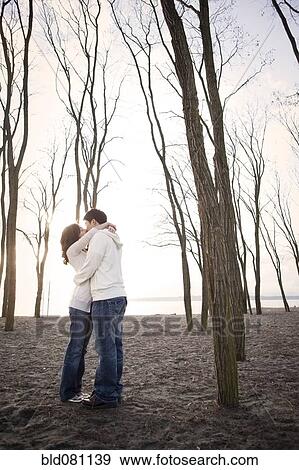 Stock Photo - Korean couple kissing on beach. Fotosearch