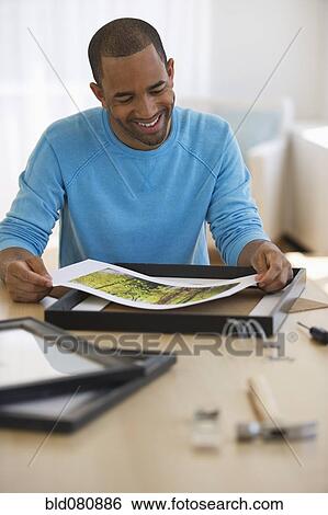 Mixed race man framing picture View Large Photo Image Stock Photograph - Mixed race man framing picture. Fotosearch
