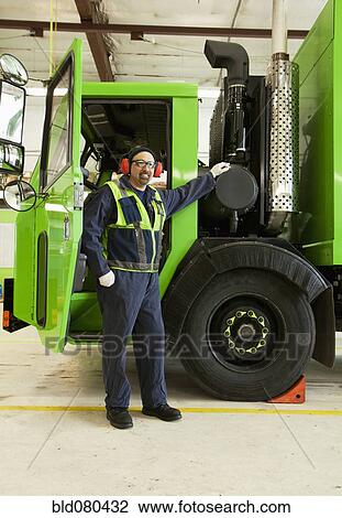 Pacific Islander man standing by garbage truck View Large Photo Image Stock Image - Pacific Islander man standing by garbage truck. Fotosearch