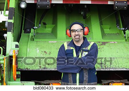 Pacific Islander man standing by garbage truck View Large Photo Image Stock Image - Pacific Islander man standing by garbage truck. Fotosearch