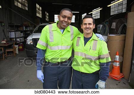 Sanitation workers in garage View Large Photo Image Stock Image - Sanitation workers in garage. Fotosearch