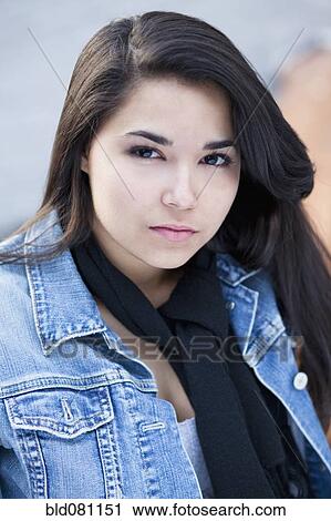 Stock Image - Serious Hispanic woman. Fotosearch