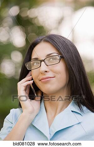 Turkish woman using cell phone View Large Photo Image Stock Photo - Turkish woman using cell phone. Fotosearch