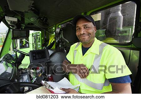African American man driving garbage truck View Large Photo Image Stock Image - African American man driving garbage truck. Fotosearch