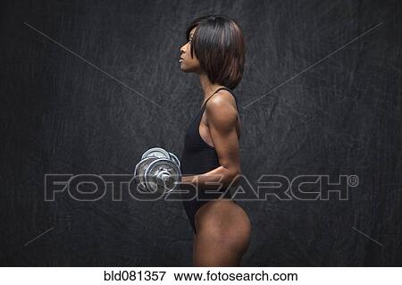 Black woman using hand weights View Large Photo Image Stock Photo - Black woman using hand weights. Fotosearch