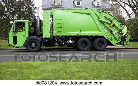 Picture - Garbage men operating garbage truck. Fotosearch