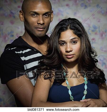 Stock Image - Hispanic couple hugging. Fotosearch