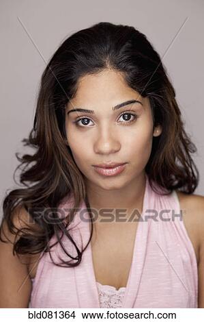 Picture - Serious Hispanic woman. Fotosearch