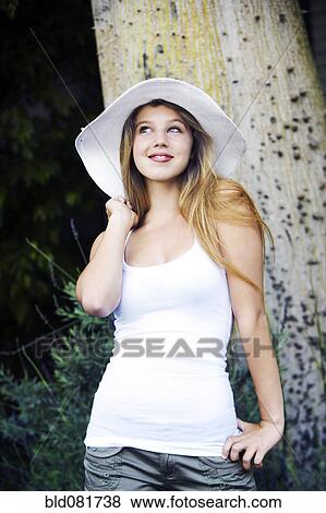 Stock Photo - Caucasian teenage girl looking up and smiling. Fotosearch