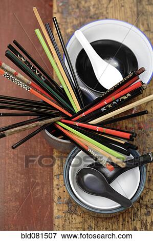 Stock Photo - Chopsticks and soup spoons. Fotosearch