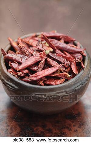 Stock Image - Close up of chili piquin in bowl. Fotosearch