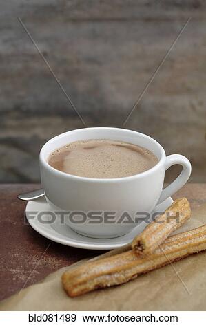 Close up of churros and Mexican hot chocolate View Large Photo Image Stock Photo - Close up of churros and Mexican hot chocolate. Fotosearch