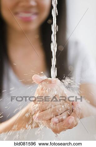 Close up of mixed race teenage girl washing hands in water View Large Photo Image Stock Photograph - Close up of mixed race teenage girl washing hands in water. Fotosearch