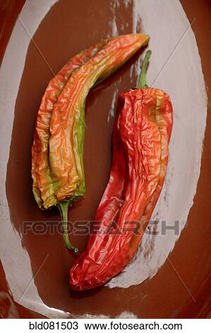 Stock Image - Close up of red chili pods. Fotosearch